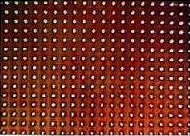 Gaten in een polyamide folie geboord met een excimeerlaser Gaten in een polyamide folie geboord met een excimeerlaser